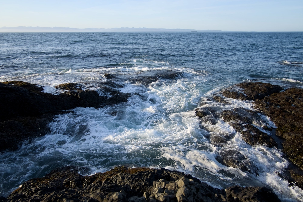 Waves crashing over the Tide Pools at Salt Creek Recreation Area in Washington.