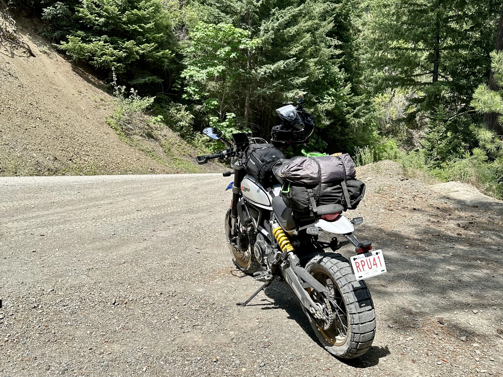Lucia with her lil' bike backpack in July 2023. Since then I've added saddlebags to bring my total waterproofed luggage capacity to 84 litres.